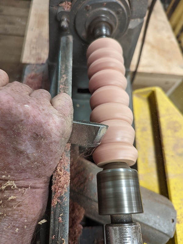 Image of John working on lathe