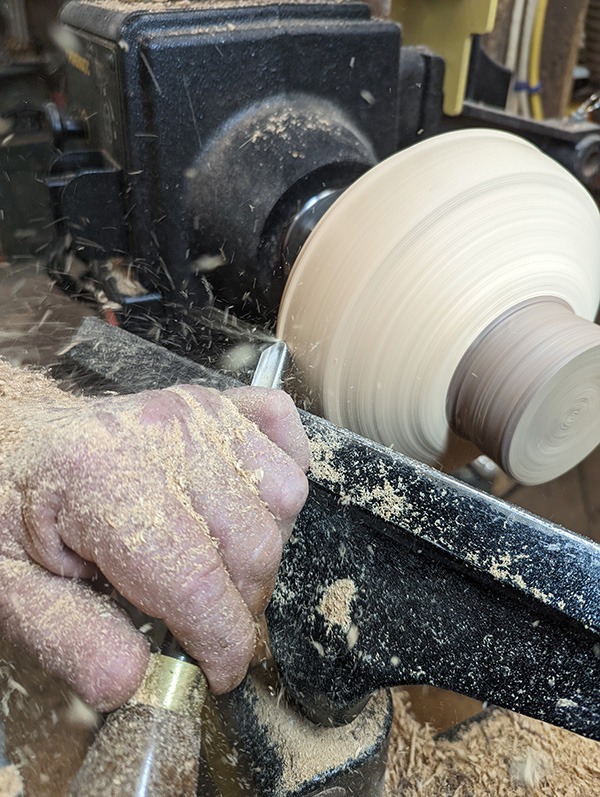 Image of John working on lathe